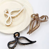 JUMBO CELLULOSE CASTING BOW HAIR CLAW CLIPS | 40H759