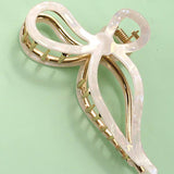 JUMBO CELLULOSE CASTING BOW HAIR CLAW CLIPS | 40H759